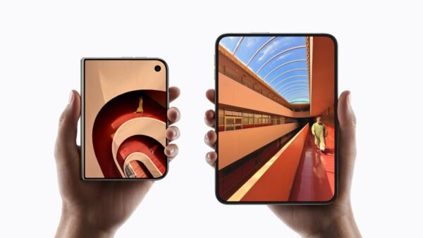 Two hands holding the Apple iPhone Duo, one folded and one unfolded, official Apple image