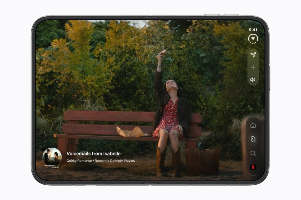An open iPhone Duo showing a video on its inner foldable display